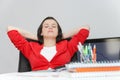 Beautiful business woman dreaming while working on computer at her office Royalty Free Stock Photo