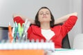 Beautiful business woman dreaming while working on computer at her office Royalty Free Stock Photo