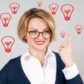 Beautiful business woman has an idea. Brainstorm. Light bulbs Royalty Free Stock Photo