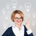 Beautiful business woman has an idea. Brainstorm. Light bulbs Royalty Free Stock Photo