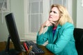 Beautiful Business Woman At Her Desk Thinking Royalty Free Stock Photo