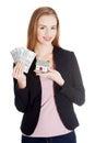 Beautiful business woman holding dollar currency and house. Royalty Free Stock Photo