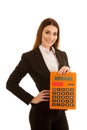 Beautiful business woman holds a large calculator isolated over Royalty Free Stock Photo