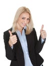 Beautiful business woman making a victory gesture Royalty Free Stock Photo