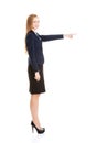 Beautiful business woman pointing on copy space. Royalty Free Stock Photo