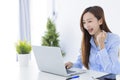 Beautiful business woman using laptop, exciting and celebrating with good news of business successful Royalty Free Stock Photo