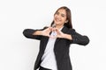 beautiful business woman wearing black suit smiling is gesturing a heart with fingers Royalty Free Stock Photo