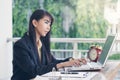 Beautiful business woman working and her typing on laptop keybord, with documents, Files and books on his wood table. she working Royalty Free Stock Photo