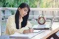 Beautiful business woman working and her writing on white paper Royalty Free Stock Photo