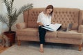 Beautiful business woman working at home. Multi-tasking, freelance and motherhood concept Royalty Free Stock Photo