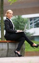 Beautiful business woman working with laptop in park Royalty Free Stock Photo