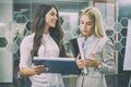 Beautiful business women discussing document during a meeting in office. Royalty Free Stock Photo