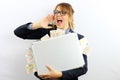 Beautiful businesswoman with elegant suit and eyeglasses on white background is holding a briefcase full of money coming out of it Royalty Free Stock Photo