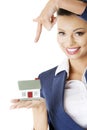 Beautiful businesswoman holding house model Royalty Free Stock Photo