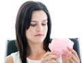 Beautiful businesswoman holding a piggy-bank