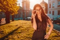 Beautiful businesswoman poses outdoors. Middle-eastern woman smiling on city street. Fashion Royalty Free Stock Photo