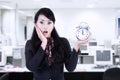 Beautiful businesswoman shock at deadline clock