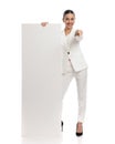 beautiful businesswoman showing empty board and pointing finger forward Royalty Free Stock Photo