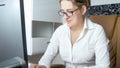 Portrait of beautiful businesswoman sitting behind desk and working on computer Royalty Free Stock Photo