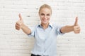 Beautiful businesswoman smiling and giving two thumbs up Royalty Free Stock Photo