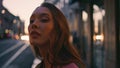 Beautiful businesswoman standing late evening street enjoying cityscape close up Royalty Free Stock Photo