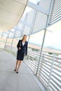 A beautiful businesswoman walking in a business building Royalty Free Stock Photo