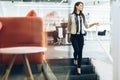 Beautiful businesswoman walking down the stairs Royalty Free Stock Photo