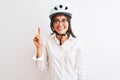 Beautiful businesswoman wearing glasses and bike helmet over isolated white background showing and pointing up with finger number Royalty Free Stock Photo