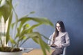 Beautiful businesswoman wearing glasses sitting in loft office r Royalty Free Stock Photo