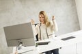 Beautiful businesswoman working on laptop in bright modern office Royalty Free Stock Photo