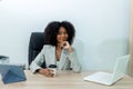 Beautiful businesswoman working on laptop in bright modern office Royalty Free Stock Photo