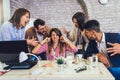 Businesswoman at workplace, ignoring work, not listening to annoying clients or bothering colleagues talking to her