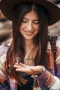 Beautiful butterfly on girl hand. stylish hipster,happy woman in