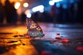 Beautiful butterfly sitting on the ground in the city at night, colourful butterfly on the side walk of a busy street, lots of