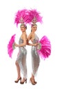 Beautiful cabaret dancers in costumes with rhinestones and purple feathers isolated on white