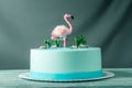 Beautiful cake, decorated with a figure of pink flamingos in the pond. Concept of the Original design of desserts