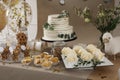 Beautiful cake and other treats on table in room. Baby shower party Royalty Free Stock Photo