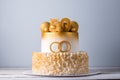 Beautiful cake for the 50th anniversary of the wedding decorated with gold balls and rings. Concept of festive desserts