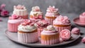 beautiful cakes on beautiful plates in pink and white colors on a gray concrete background