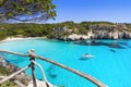 Beautiful Cala Macarella beach, Menorca island, Spain. Sailing boat in a bay. Summer fun, enjoying life, yachting, travel and acti Royalty Free Stock Photo