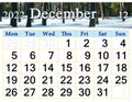 calendar for December 2022 with image of wintter pine forest covered in snow.