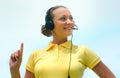 Beautiful call centre operator or client services smiles trying Royalty Free Stock Photo