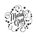 Beautiful calligraphy of the words - Mardi Gras - in bold, elegant letters.