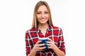 Beautiful calm girl smiles with a cup standing on a white background Royalty Free Stock Photo