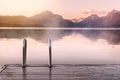 Beautiful calm peaceful scenic foggy lake and mountains view from wood decking, relaxation, tranquility, wanderlust