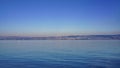 Beautiful calm waters of Lake Geneva with Lausanne cityscape. Royalty Free Stock Photo