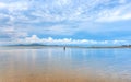 Beautiful calmness seascape with fisherman in cloudy blue sky