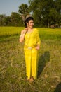 Beautiful Cambodian Asian Bride in Traditional Wedding Dress in a Rice Field