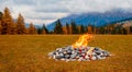 beautiful campfire in the middle of a meadow in autumn