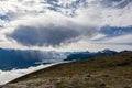 a rain cloud is pouring rain. the beauty of the mountains. Canadian mountains, clouds.